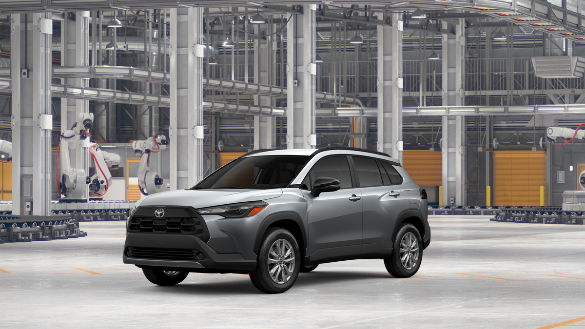 2026 Toyota Corolla Cross LE in Sonic Silver — front three-quarter view