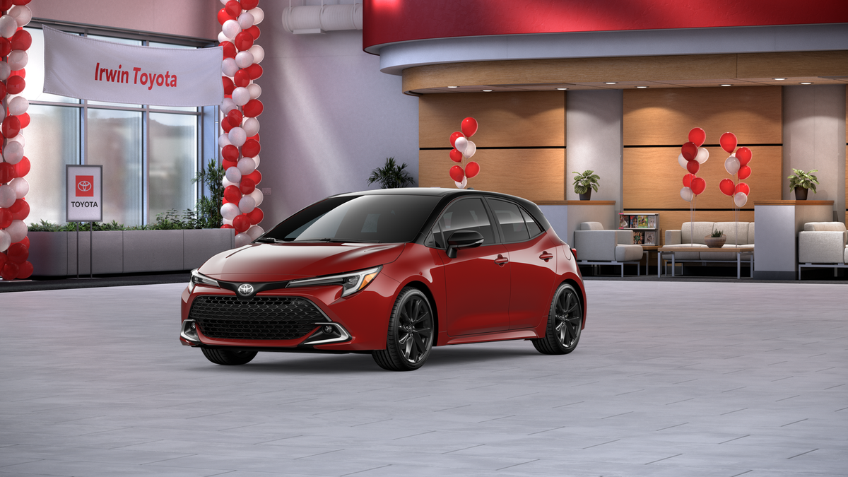 2026 Toyota Corolla Hatchback XSE in Finish Line Red With Midnight Black Metallic Roof — front three-quarter view