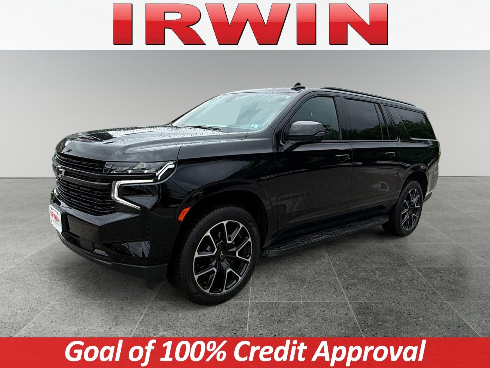 2024 Chevrolet Suburban RST in Black — front three-quarter view