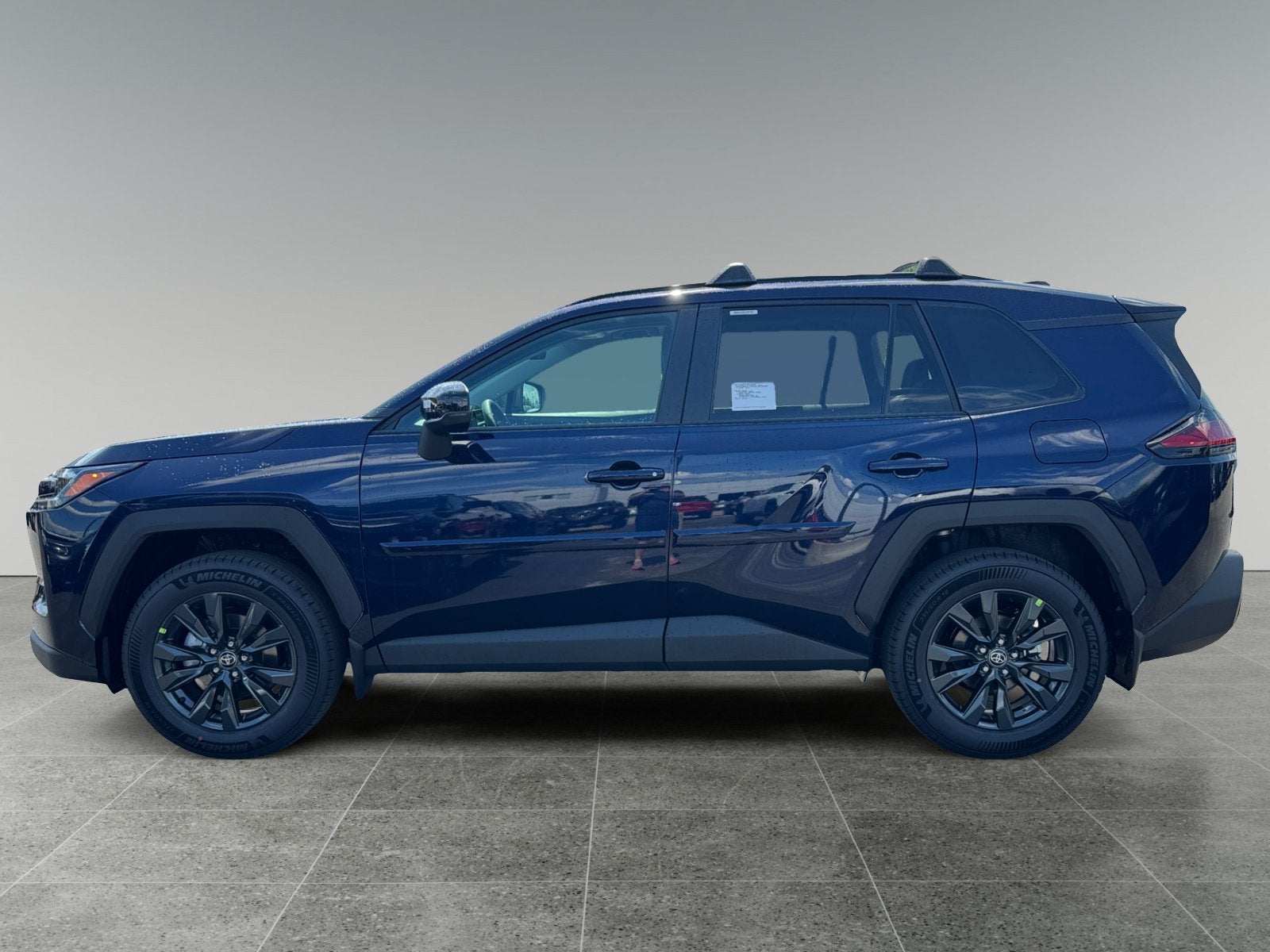 2026 Toyota RAV4 — rear three-quarter view